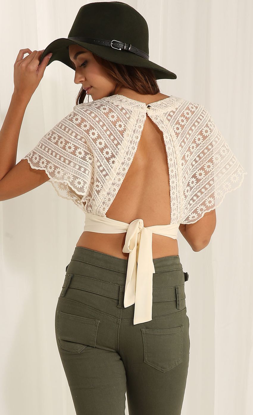 Picture Open back lace top in beige. Source: https://media-img.lucyinthesky.com/data/Apr15_1/850xAUTO/0Y5A5318F.JPG