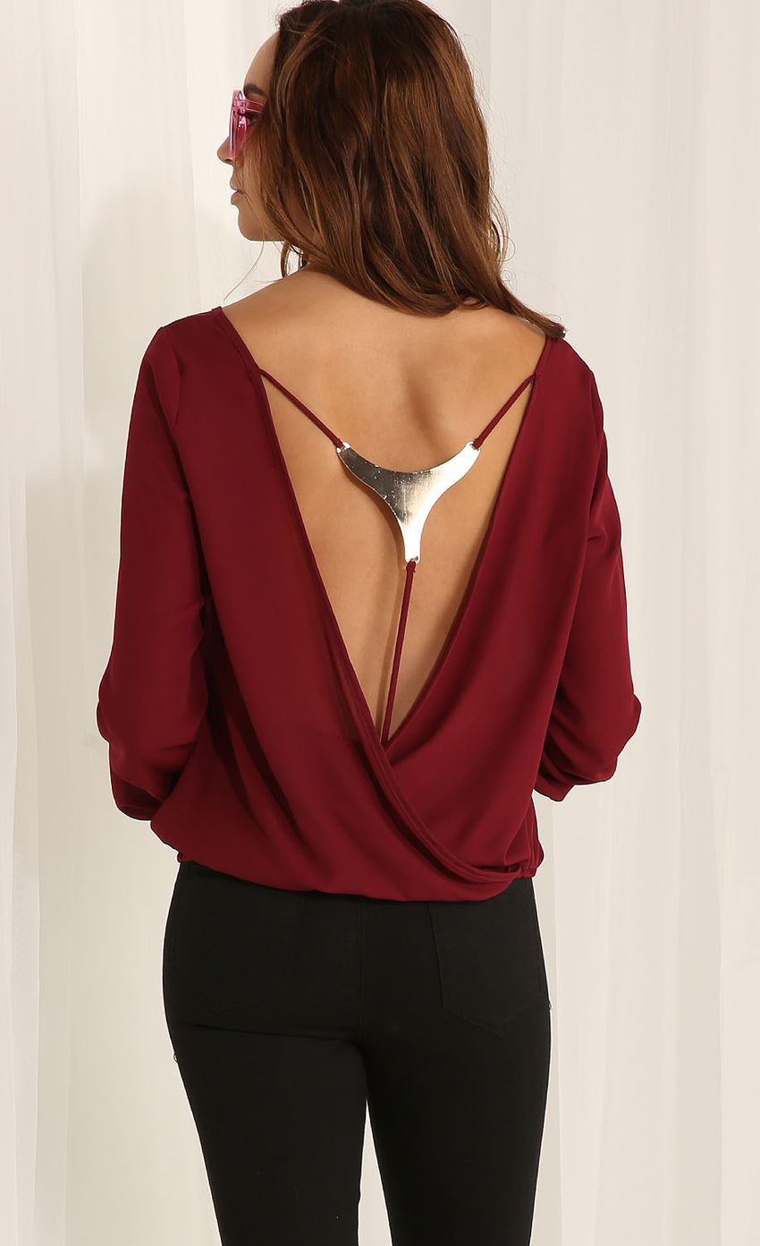 Picture Long-sleeve open-back top in burgundy. Source: https://media-img.lucyinthesky.com/data/Apr15_1/850xAUTO/0Y5A5786F.JPG