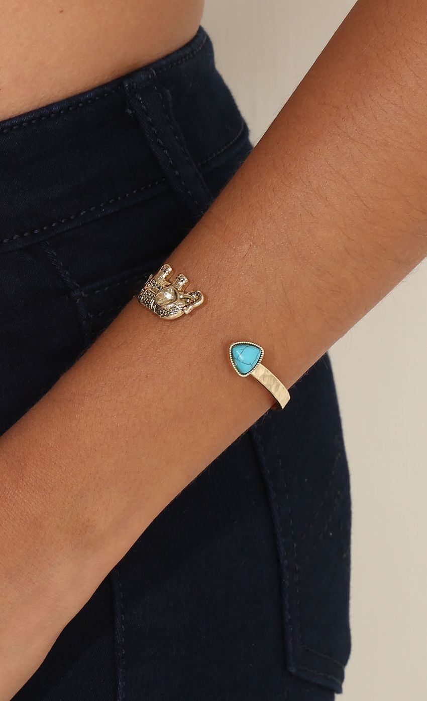 Picture Thin Elephant Wrist Cuff. Source: https://media-img.lucyinthesky.com/data/Apr15_2/850xAUTO/0Y5A3235.JPG