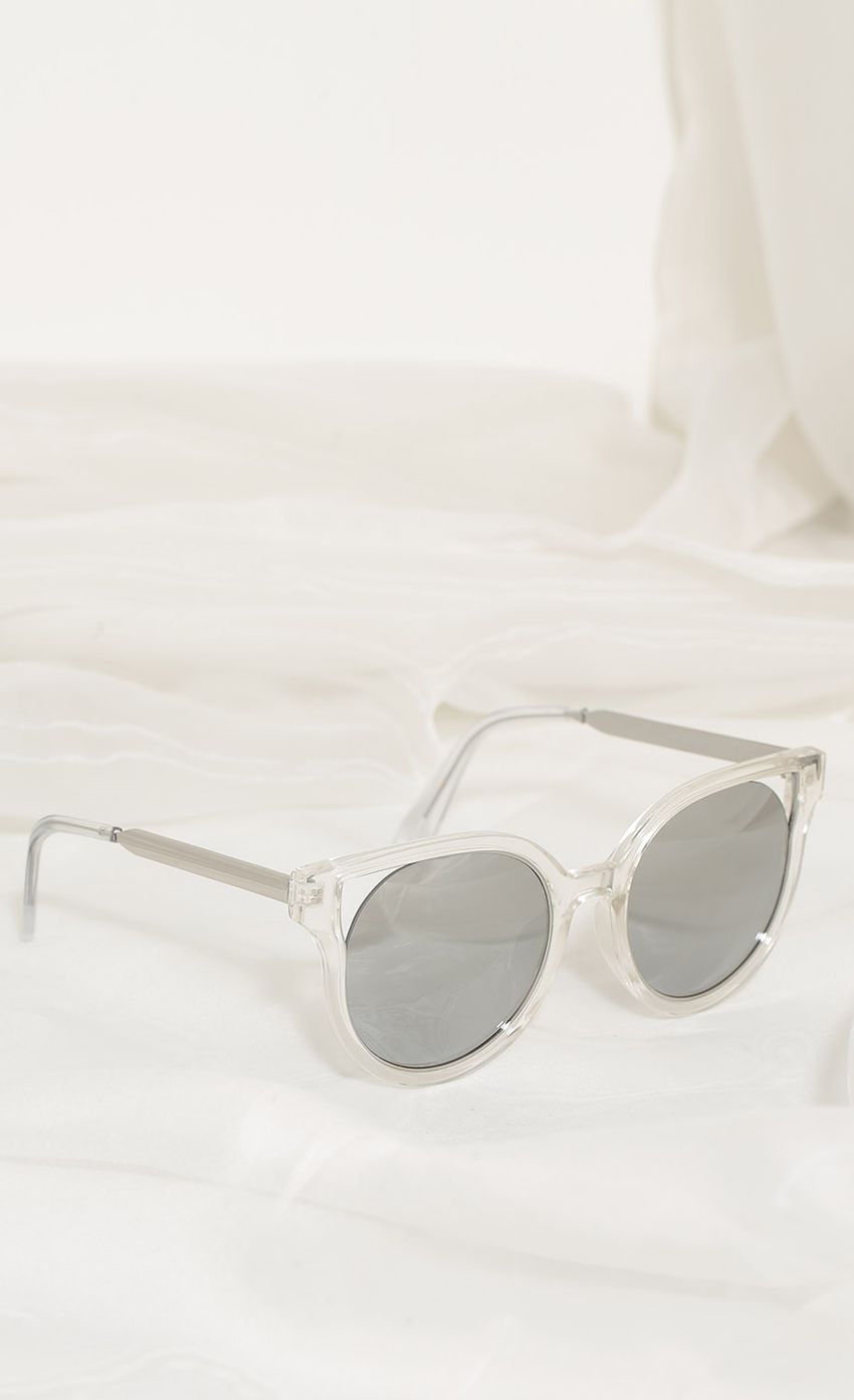 Picture Crystal Clear Cat-Eye Sunglasses In Smoke. Source: https://media-img.lucyinthesky.com/data/Apr17_2/850xAUTO/0Y5A5427.JPG