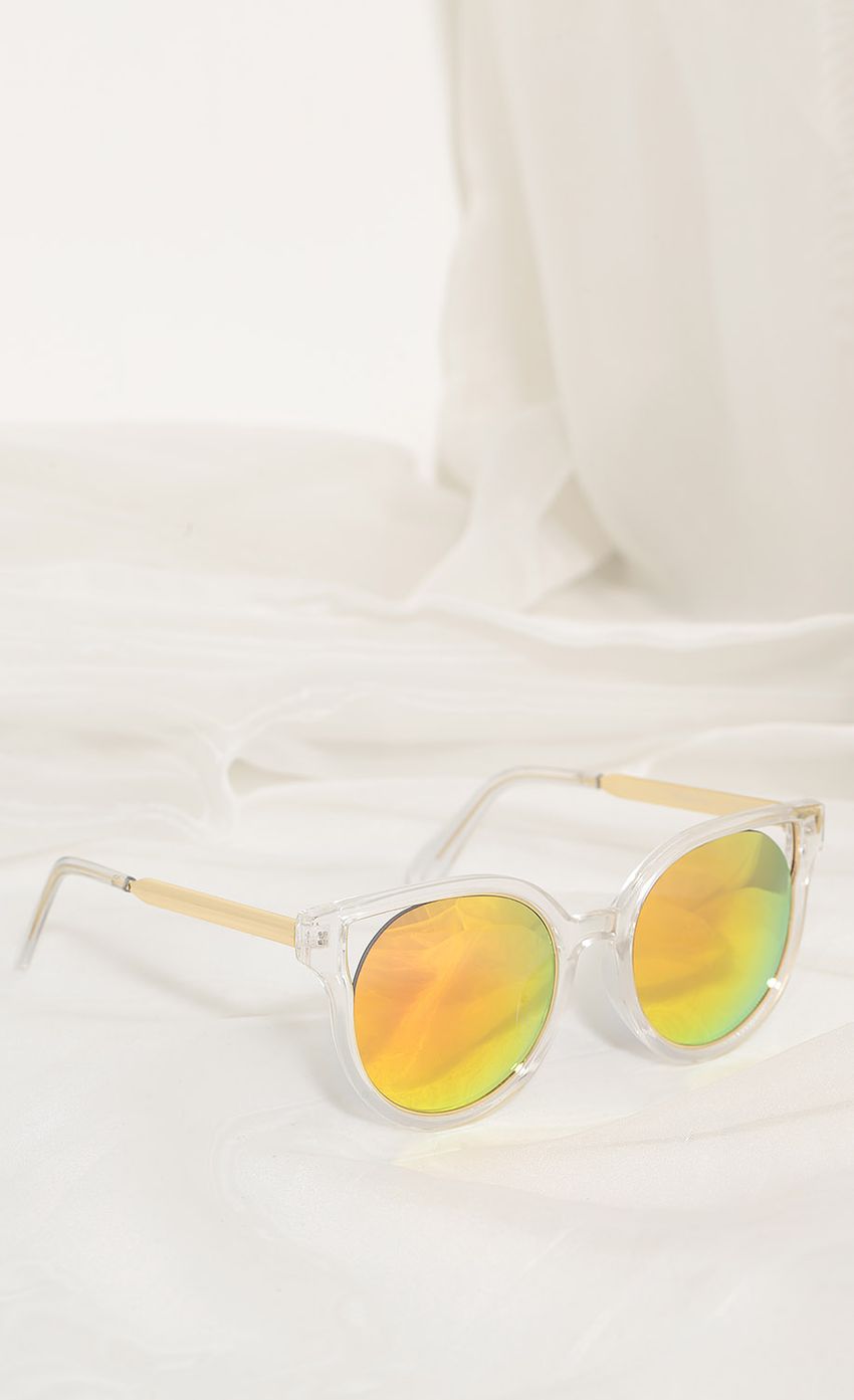 Picture Crystal Clear Cat-Eye Sunglasses In Sunset. Source: https://media-img.lucyinthesky.com/data/Apr17_2/850xAUTO/0Y5A5447.JPG