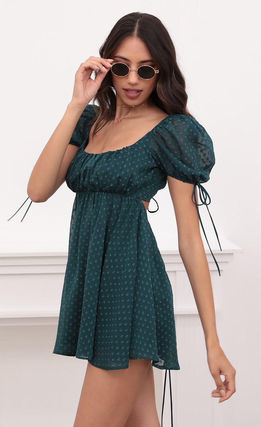 Picture Leilani Dotted Chiffon Baby Doll Dress in Hunter Green. Source: https://media-img.lucyinthesky.com/data/Apr21_1/850xAUTO/1V9A2303.JPG