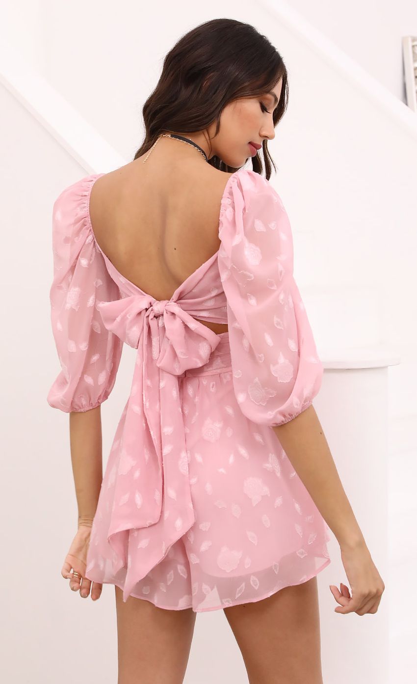 Picture Puff Sleeve Floral Romper in Pink. Source: https://media-img.lucyinthesky.com/data/Apr21_1/850xAUTO/1V9A4485.JPG