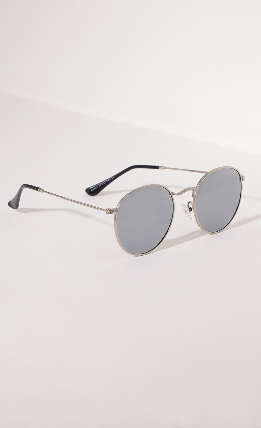 Picture Jessica Round Trim Sunglasses in Silver and Mirrored Lenses. Source: https://media-img.lucyinthesky.com/data/Apr21_1/850xAUTO/AT2A0960.JPG