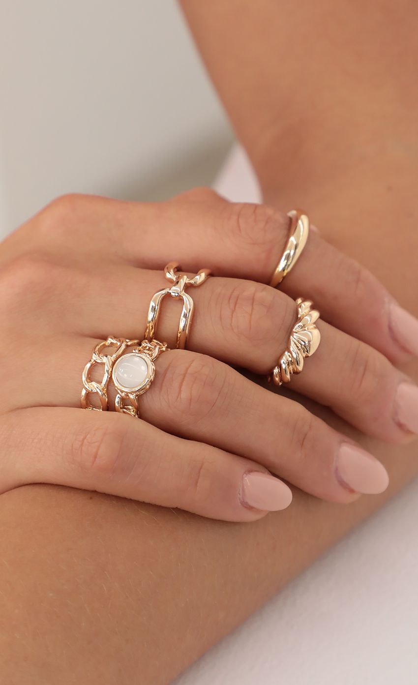 Picture 5 Piece Chain Stack Rings in Gold. Source: https://media-img.lucyinthesky.com/data/Apr21_1/850xAUTO/AT2A2146.JPG