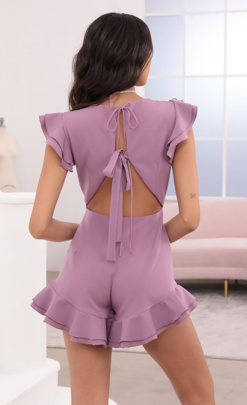 Picture V-Neck Ruffle Romper in Mauve. Source: https://media-img.lucyinthesky.com/data/Apr21_2/850xAUTO/1V9A3844.JPG