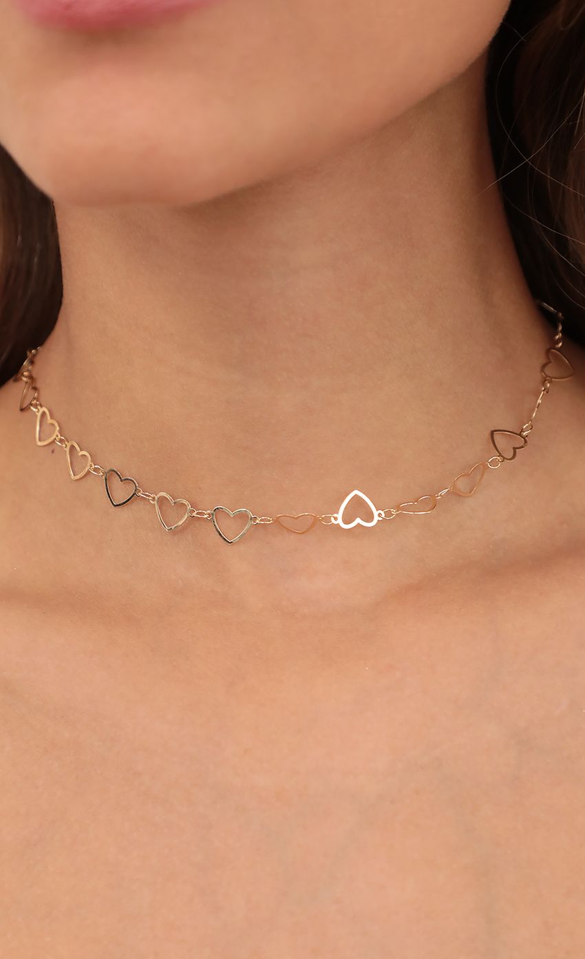 Picture Gold Heart-Link Chain Necklace. Source: https://media-img.lucyinthesky.com/data/Apr21_2/850xAUTO/AT2A3101.JPG
