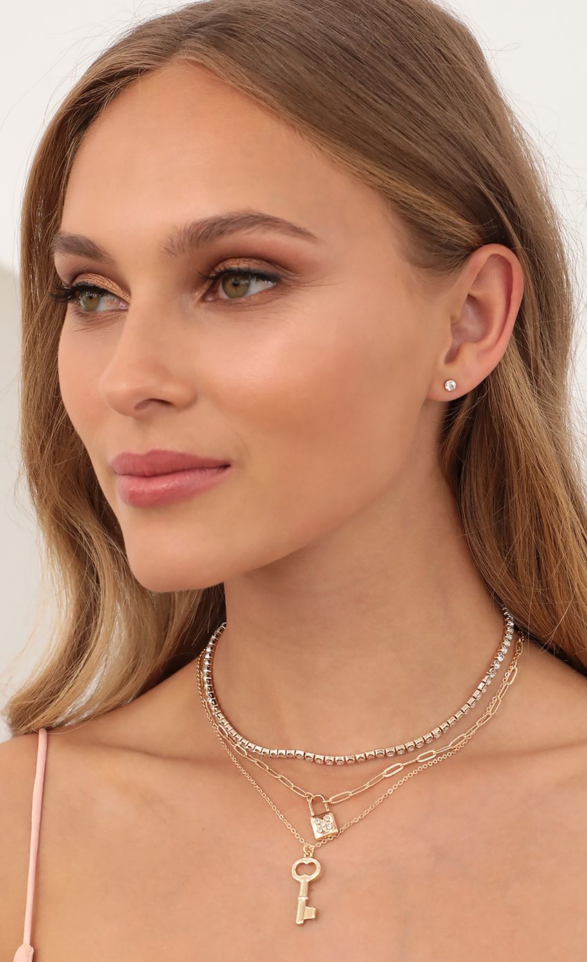 Picture Crystal Lock Necklace and Earrings Set. Source: https://media-img.lucyinthesky.com/data/Apr21_2/850xAUTO/AT2A3263.JPG