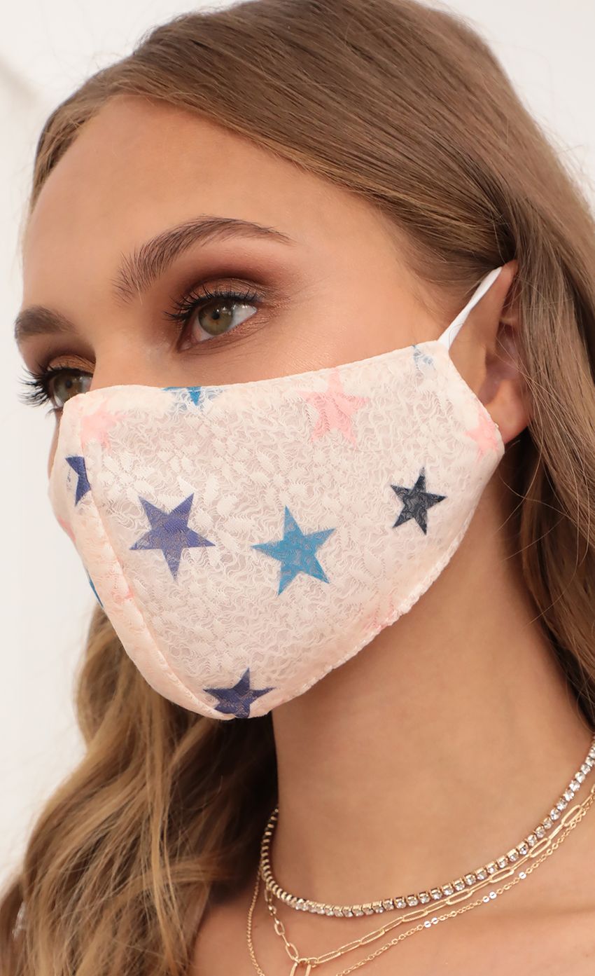 Picture Lace Stars Printed Mask in Baby Pink. Source: https://media-img.lucyinthesky.com/data/Apr21_2/850xAUTO/AT2A3319.JPG