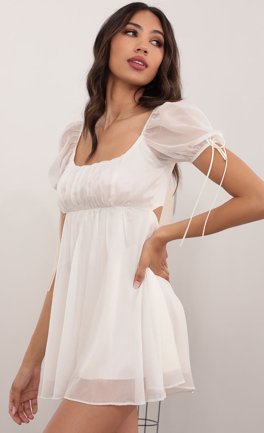 Picture Chiffon Shimmer Baby Doll Dress in White. Source: https://media-img.lucyinthesky.com/data/Apr21_2/850xAUTO/AT2A5524.JPG