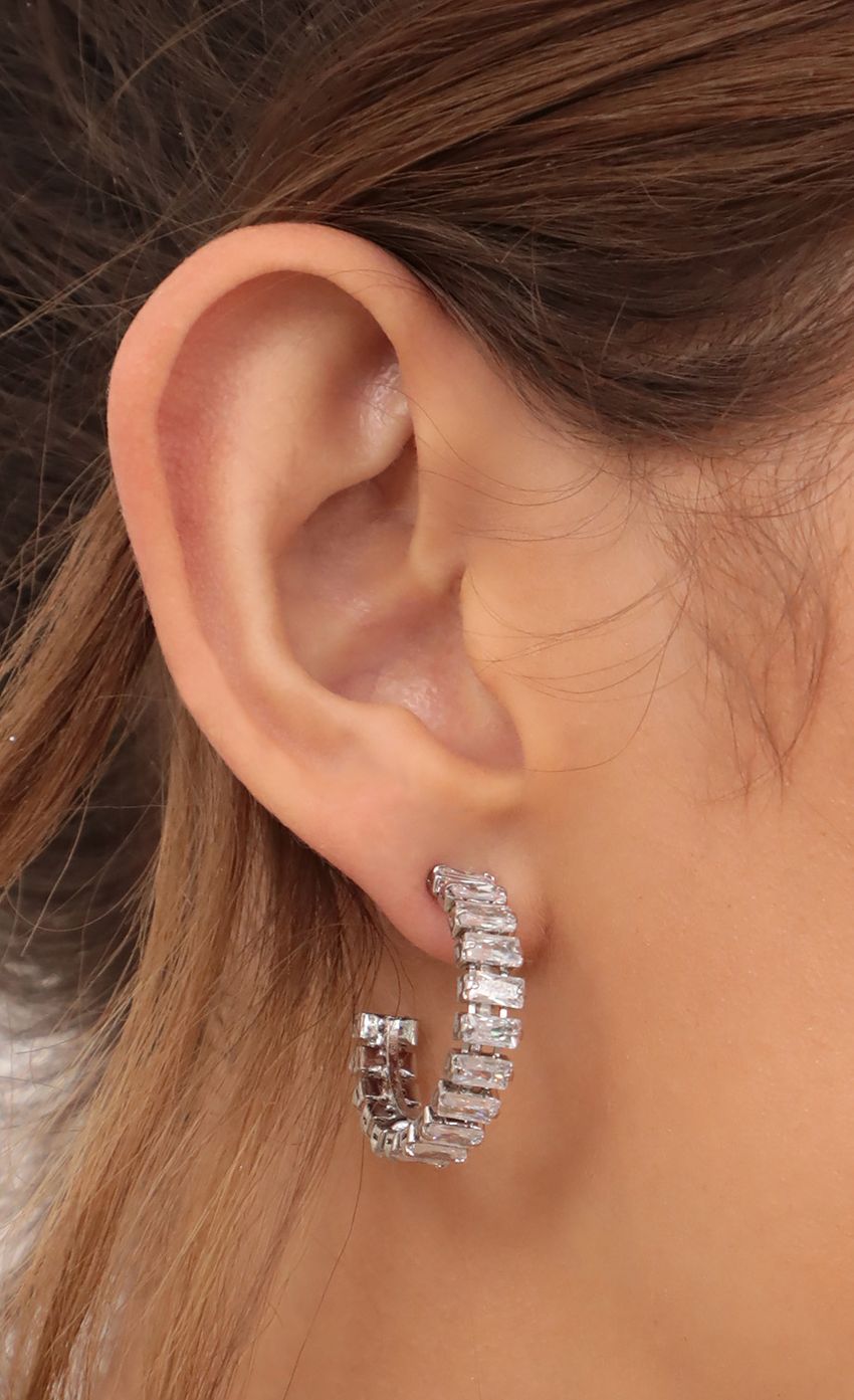 Picture Baguette Hoop Earrings in Silver. Source: https://media-img.lucyinthesky.com/data/Apr21_2/850xAUTO/AT2A8278.JPG