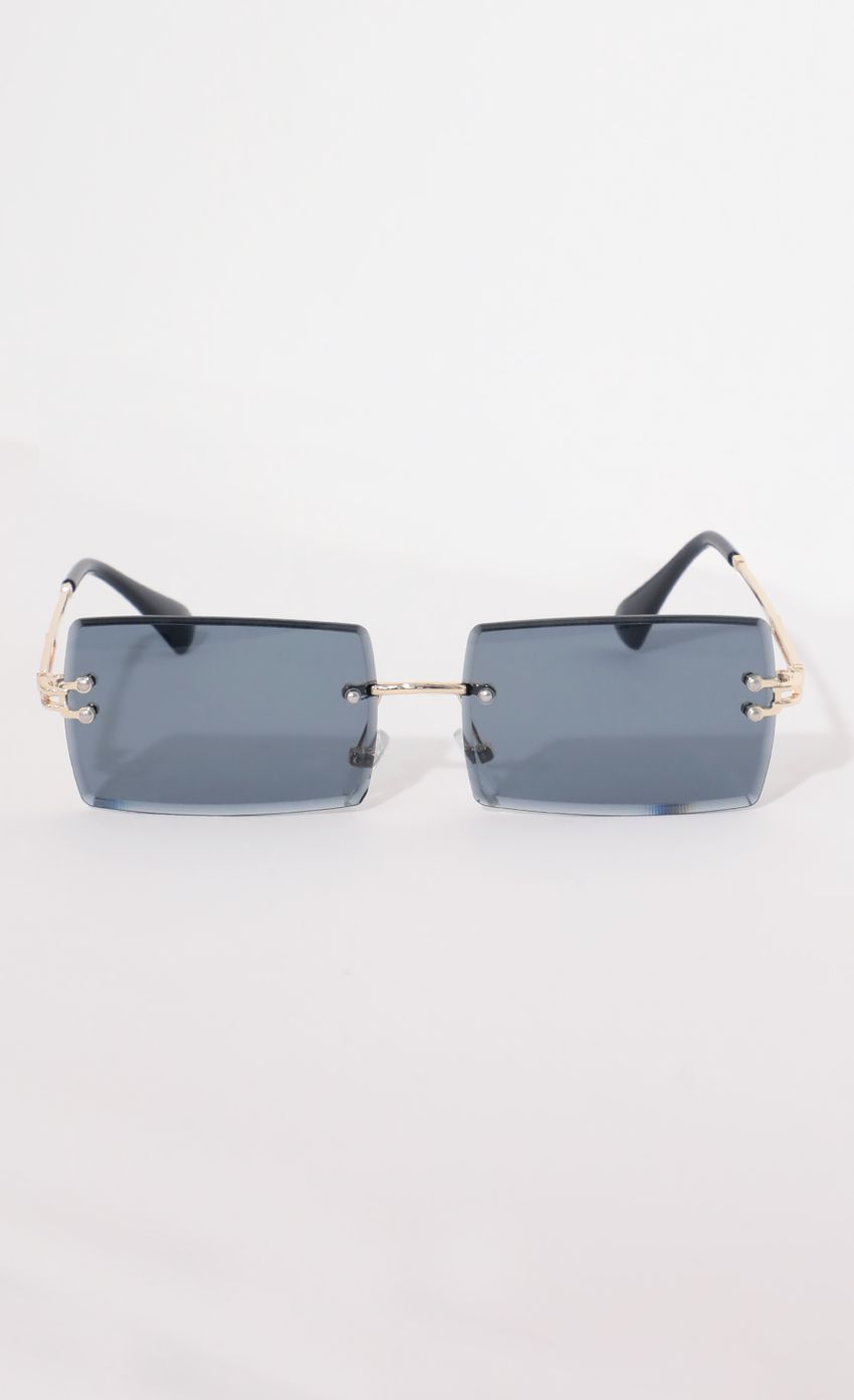Picture 90s Baby Rectangle Sunglasses in Navy. Source: https://media-img.lucyinthesky.com/data/Apr21_2/850xAUTO/AT2A9133.JPG