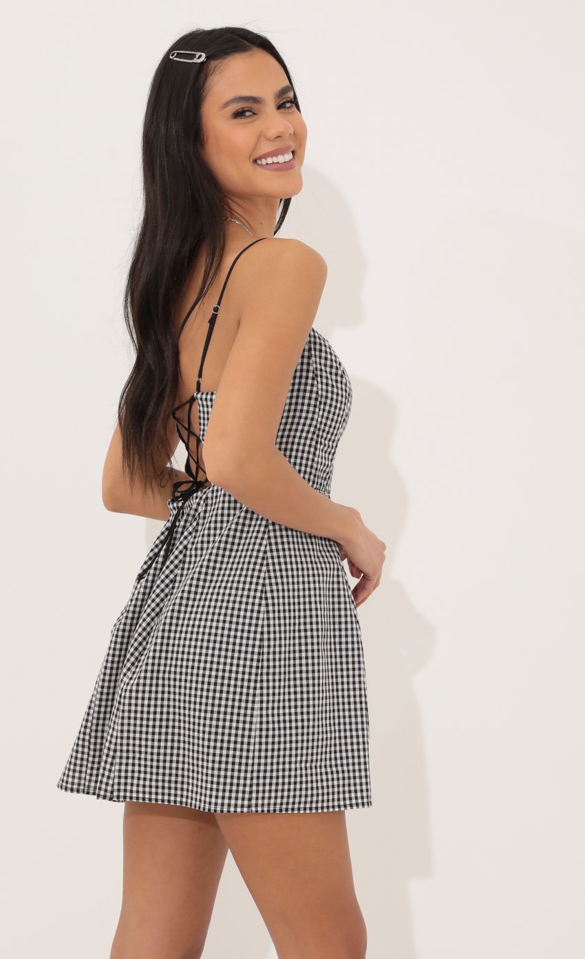 Picture A-line dress in Black and White Checkered. Source: https://media-img.lucyinthesky.com/data/Apr22_1/850xAUTO/1V9A5779.JPG