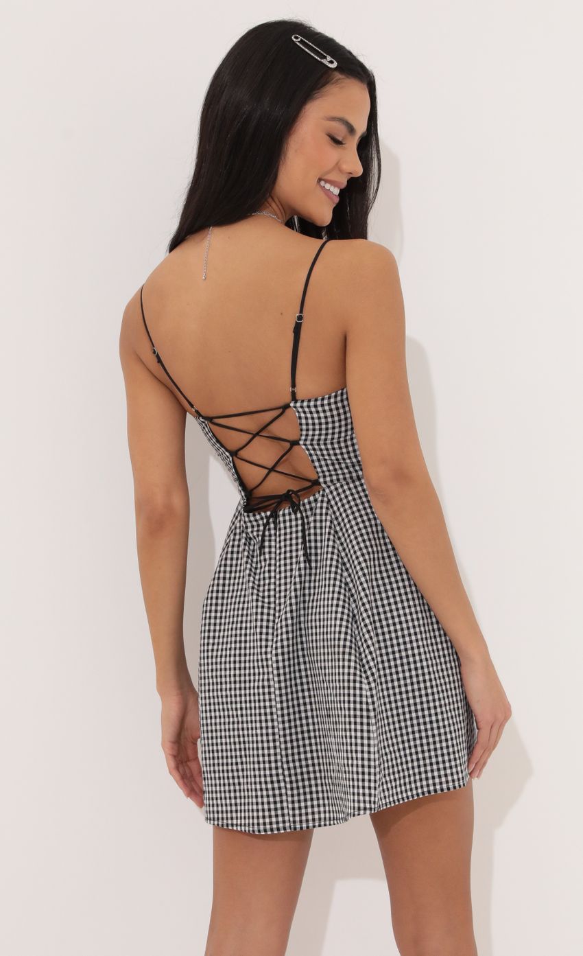 Picture A-line dress in Black and White Checkered. Source: https://media-img.lucyinthesky.com/data/Apr22_1/850xAUTO/1V9A5801.JPG