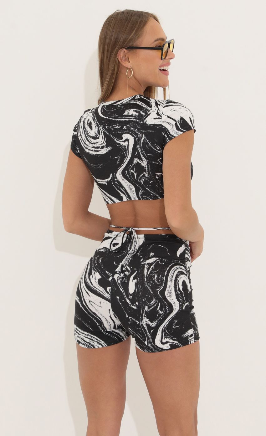 Picture Two Piece Set in in Black Swirl. Source: https://media-img.lucyinthesky.com/data/Apr22_2/850xAUTO/1V9A3698.JPG