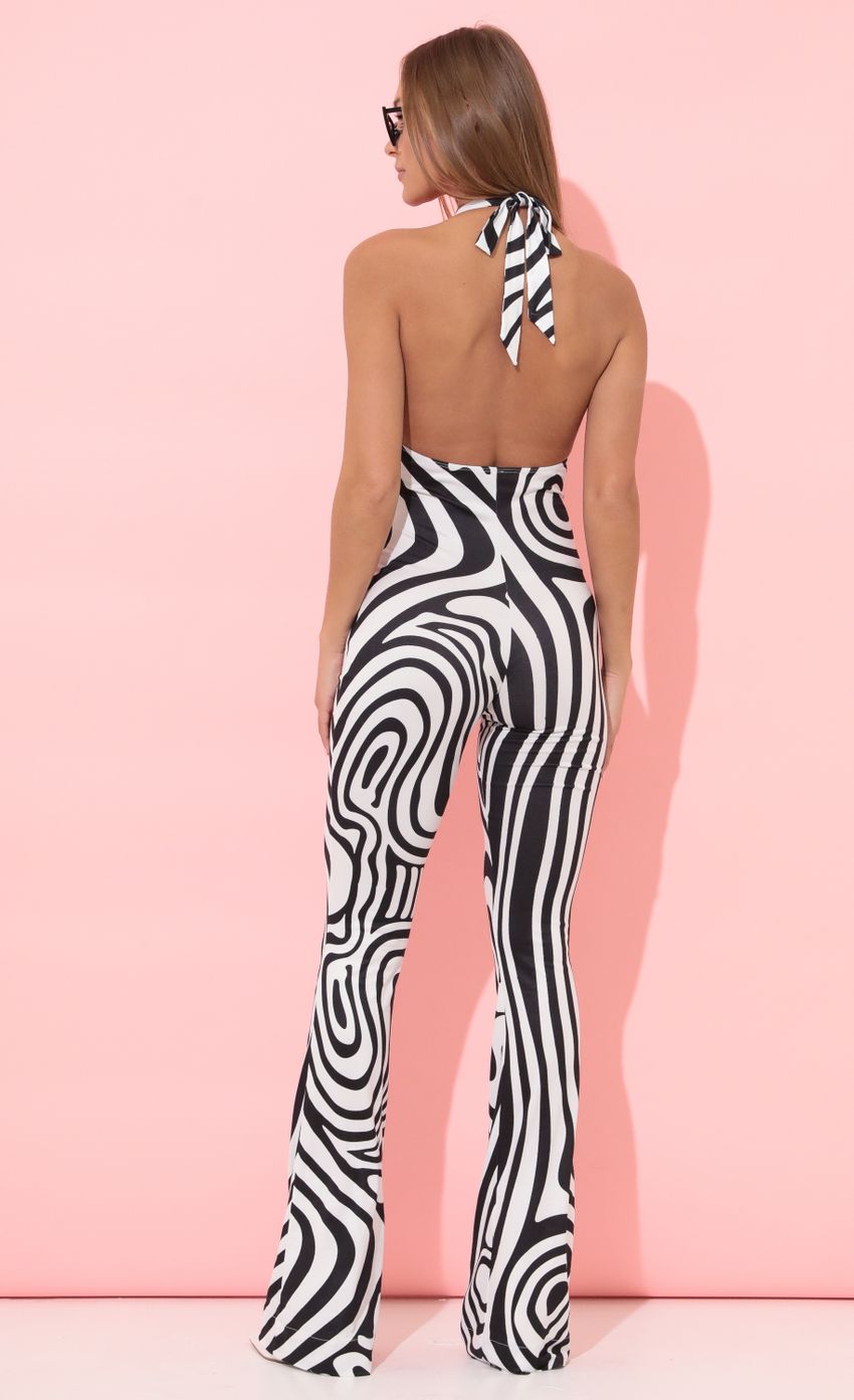 Picture Shimmer Jumpsuit in Black Stripes. Source: https://media-img.lucyinthesky.com/data/Apr22_2/850xAUTO/1V9A6312.JPG