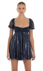 Picture Sequin Puff Sleeve Baby Doll Dress in Navy. Source: https://media-img.lucyinthesky.com/data/Apr23/150xAUTO/64c0832d-13d8-4819-abf0-bc8fb8780f9e.jpg