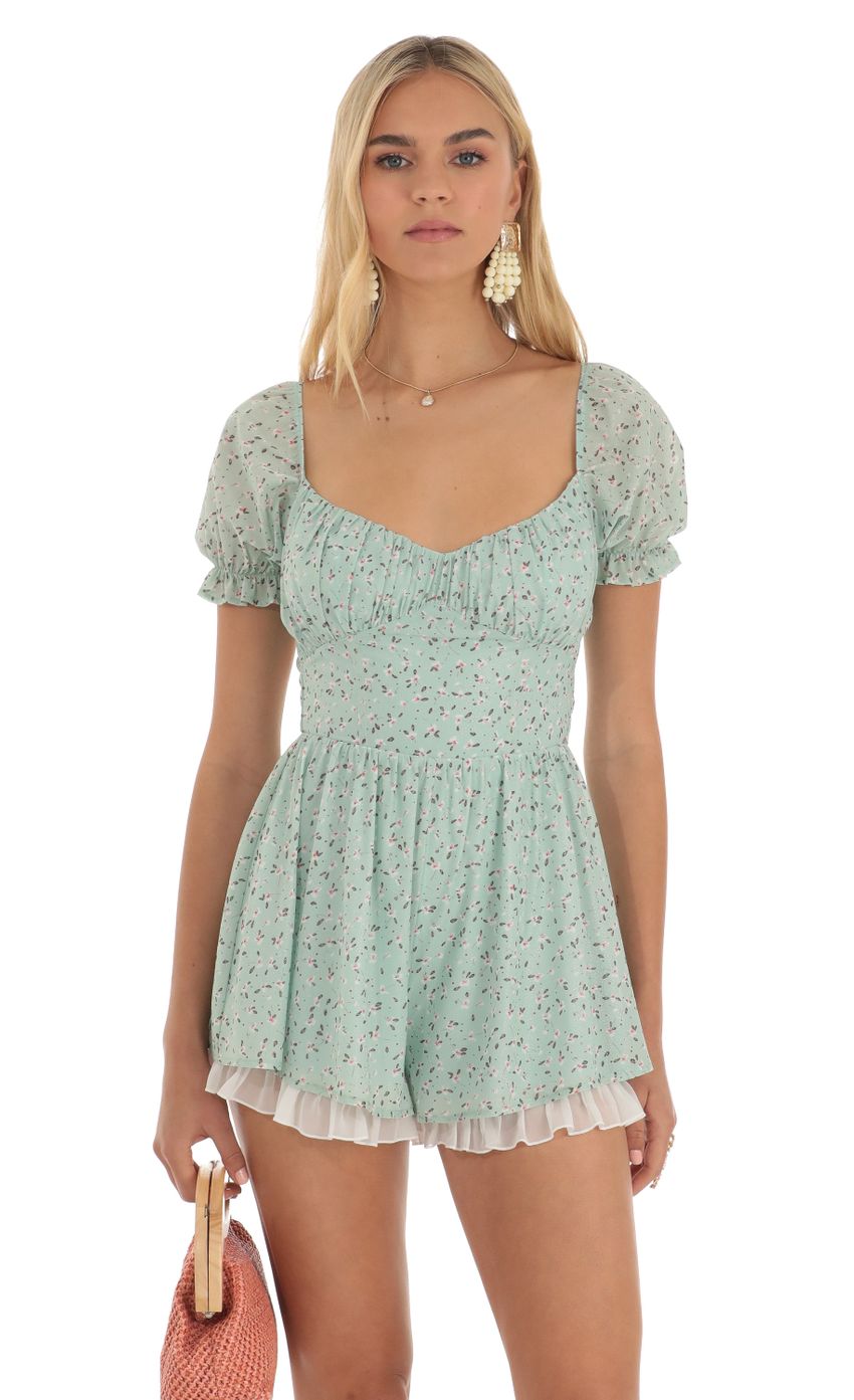 Picture Floral Foiled Romper in Green. Source: https://media-img.lucyinthesky.com/data/Apr23/850xAUTO/03dfff6a-f3fb-4c7c-a979-993195fba6eb.jpg