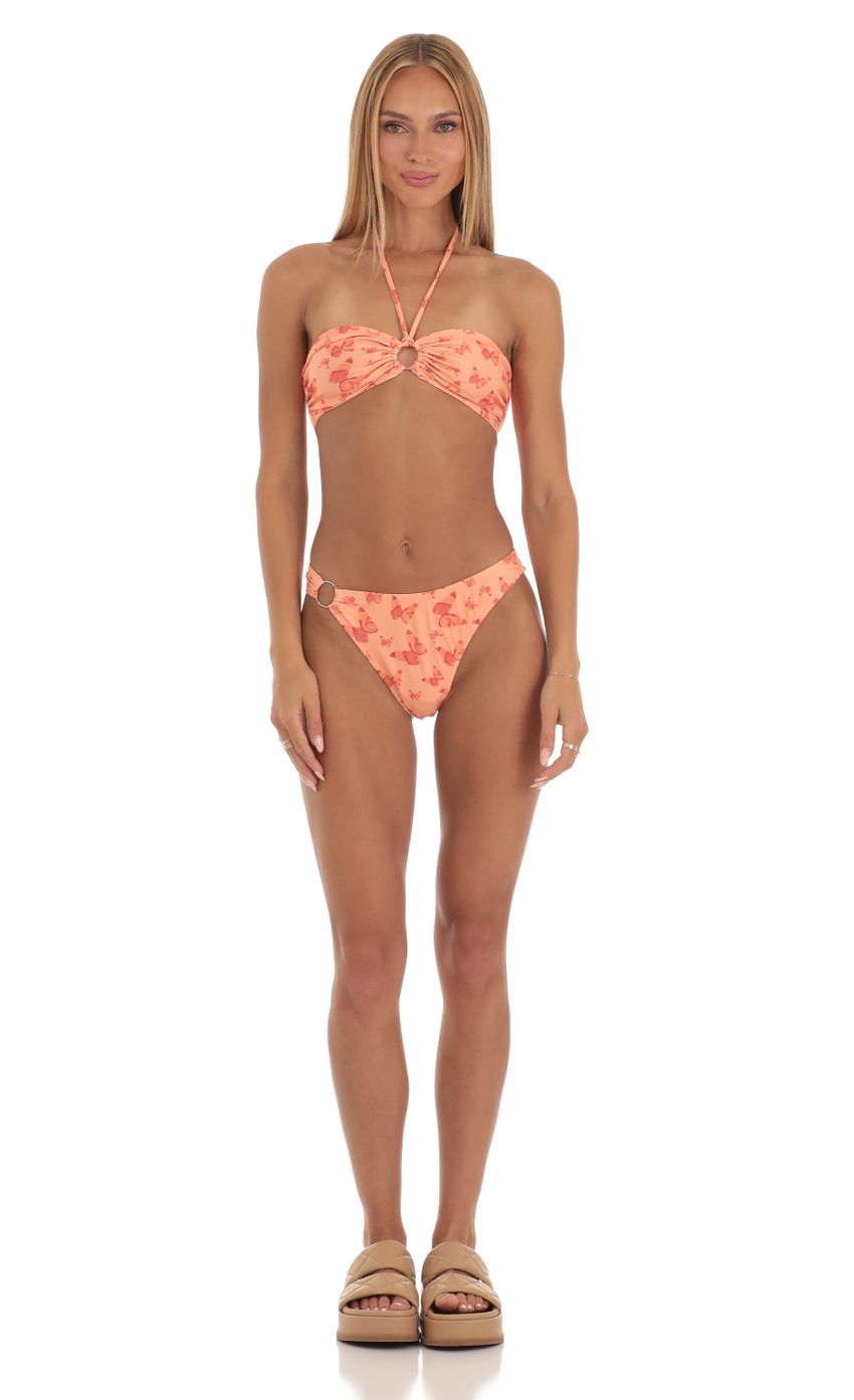 Picture Carmella Halter Bikini Set in Orange Print. Source: https://media-img.lucyinthesky.com/data/Apr23/850xAUTO/250af3ce-758d-466e-b4b9-ed9b958a93e5.jpg