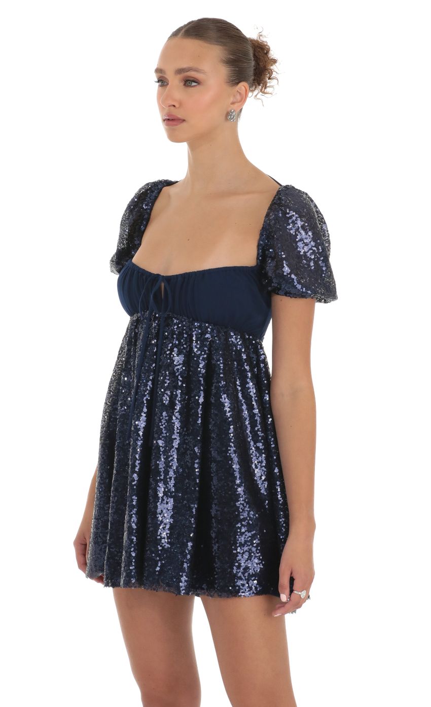 Picture Sequin Puff Sleeve Baby Doll Dress in Navy. Source: https://media-img.lucyinthesky.com/data/Apr23/850xAUTO/83e5b454-7d9b-4986-a211-7c1951df9abc.jpg