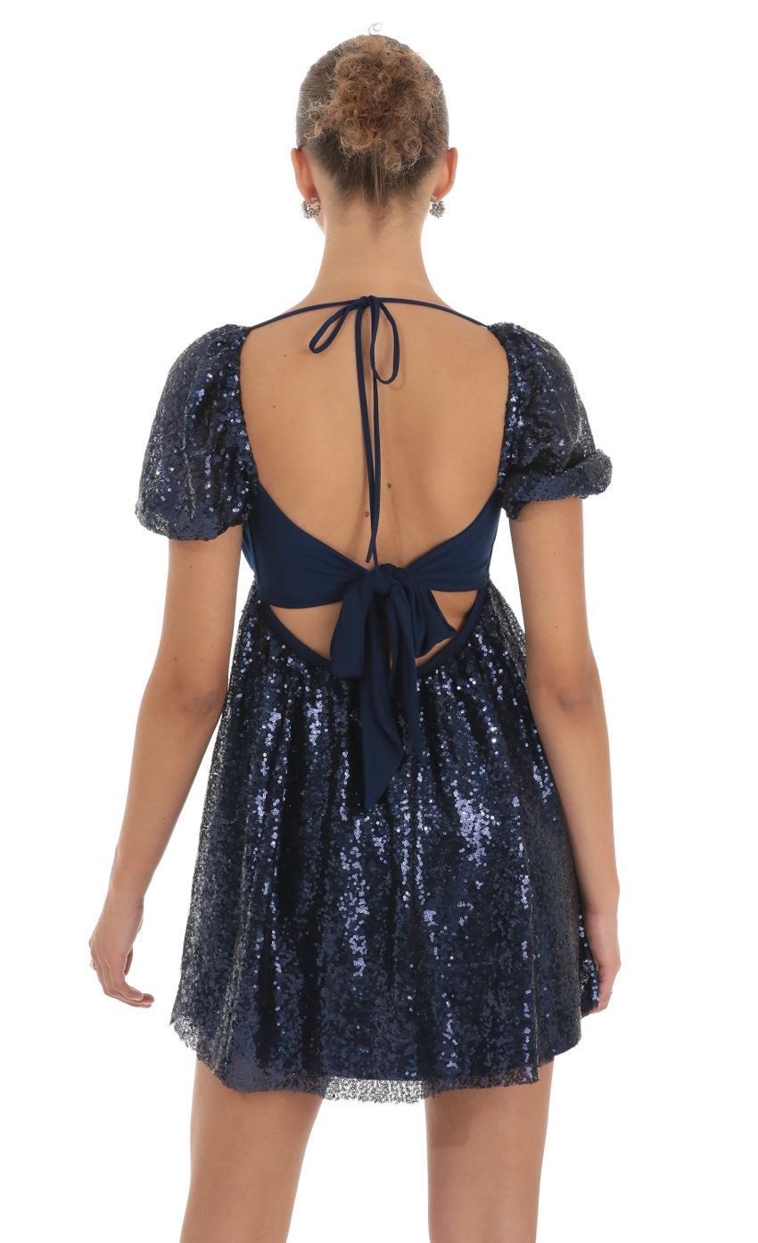 Picture Sequin Puff Sleeve Baby Doll Dress in Navy. Source: https://media-img.lucyinthesky.com/data/Apr23/850xAUTO/ae54277f-a22e-4f38-8eda-d05a165cd9bb.jpg