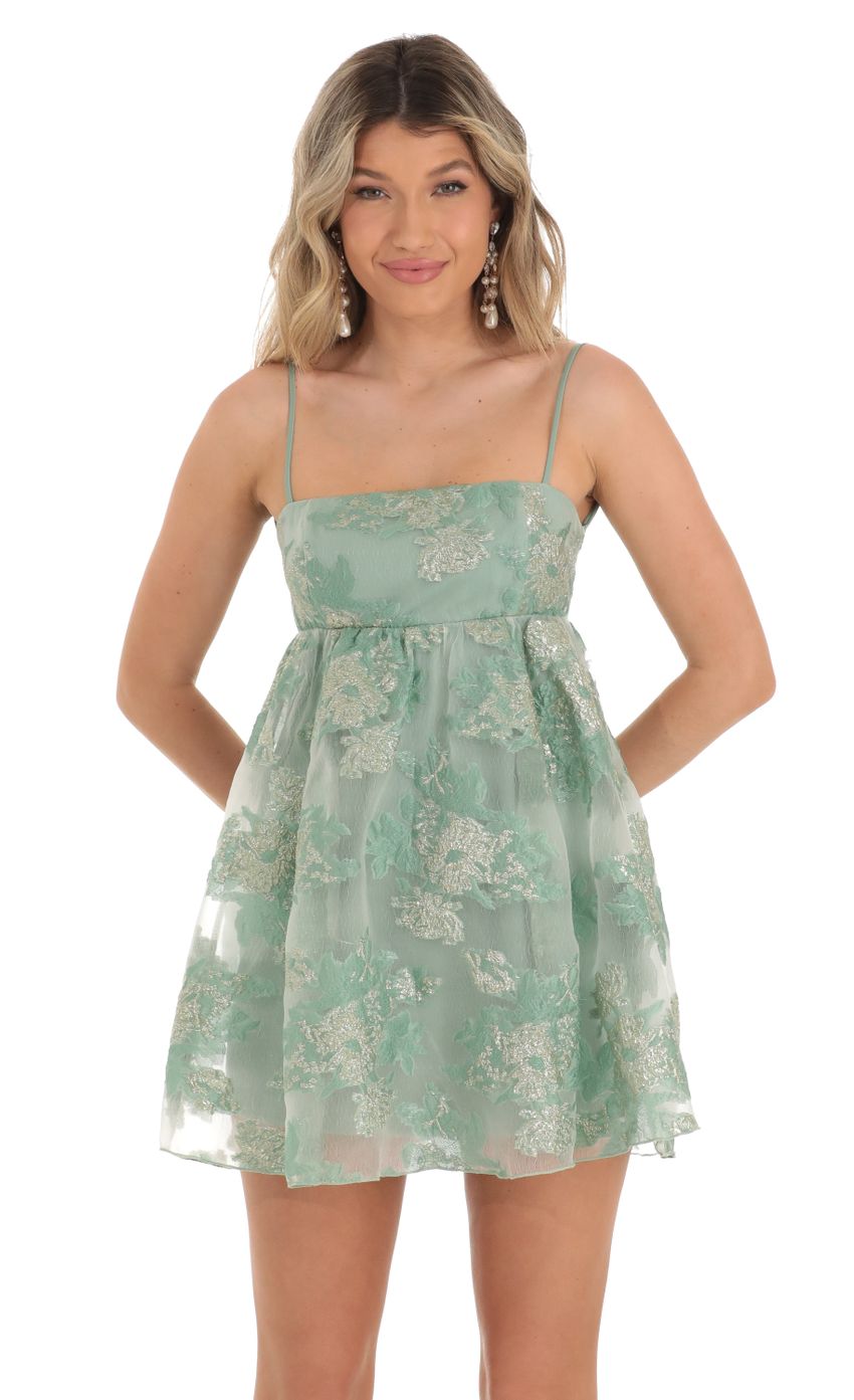 Picture Shimmer Floral Baby Doll Dress in Green. Source: https://media-img.lucyinthesky.com/data/Apr23/850xAUTO/bc6f98d0-f999-440c-9eab-213d53ea7328.jpg