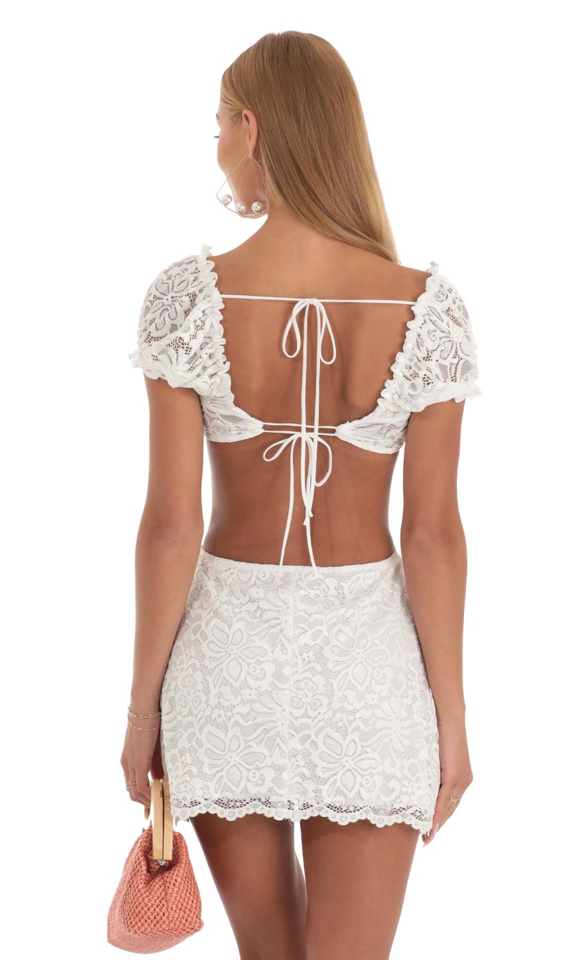 Picture Lace Cutout Dress in White. Source: https://media-img.lucyinthesky.com/data/Apr23/850xAUTO/d71553d8-e622-45b7-9fc0-6e448bbf49d9.jpg