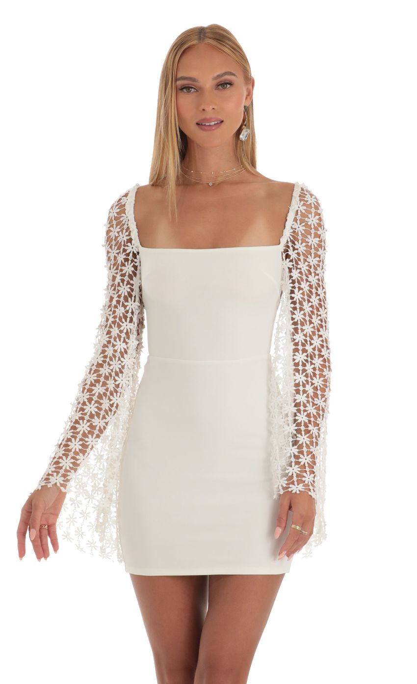 Picture Embroidered Flare Sleeve Dress in White. Source: https://media-img.lucyinthesky.com/data/Apr23/850xAUTO/e5d85a20-0a07-4770-bd8f-751328d0a49a.jpg