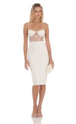 Picture Cutout Lace Midi Dress in White. Source: https://media-img.lucyinthesky.com/data/Apr24/150xAUTO/15f36d76-037e-458b-85c1-567d02d4b886.jpg