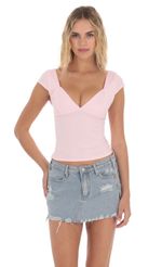 Picture Short Sleeve V-Neck Top in Pink. Source: https://media-img.lucyinthesky.com/data/Apr24/150xAUTO/20c701c9-6538-4fab-8140-846bca336b61.jpg