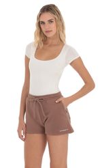 Picture Lucy in the Sky Sweat Shorts in Brown. Source: https://media-img.lucyinthesky.com/data/Apr24/150xAUTO/352d9644-ada3-4924-a6dc-3625a3c3508b.jpg