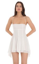 Picture Asymmetrical Side Flare Dress in White. Source: https://media-img.lucyinthesky.com/data/Apr24/150xAUTO/4e96cdc5-3edc-4ed2-ab95-4c38af618581.jpg