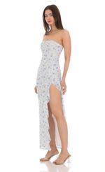 Picture Strapless Lace Ruffle Slit Dress in Cream. Source: https://media-img.lucyinthesky.com/data/Apr24/150xAUTO/6e946e66-8ba3-4dd5-b857-0c3b49533a20.jpg