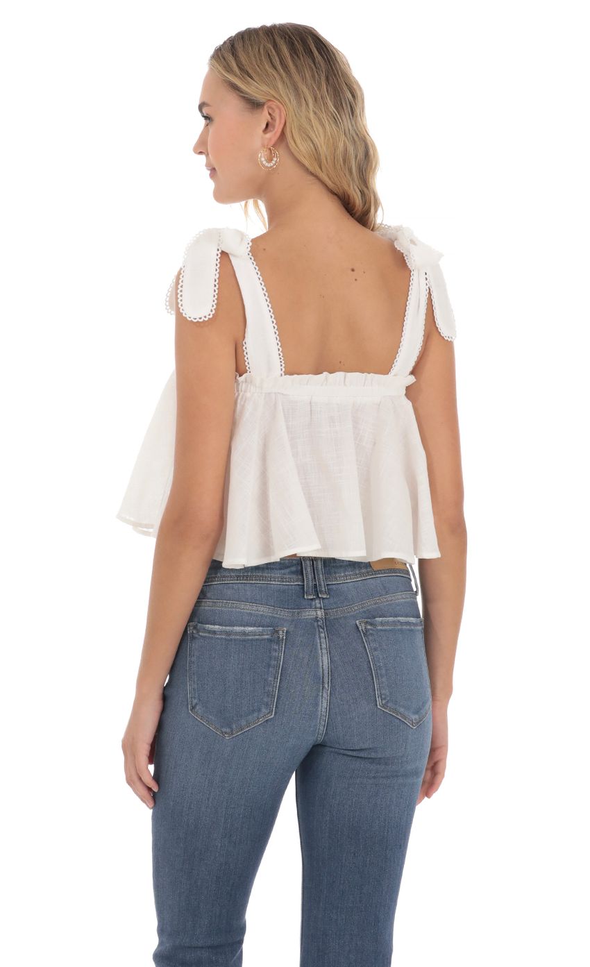 Picture Shoulder Tie Top in White. Source: https://media-img.lucyinthesky.com/data/Apr24/850xAUTO/0f6db4fe-572f-4926-8986-081167be5630.jpg