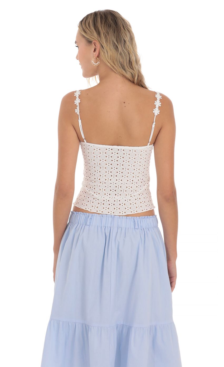 Picture Floral Strap Eyelet Top in White. Source: https://media-img.lucyinthesky.com/data/Apr24/850xAUTO/121549be-739c-4728-a959-c53c2f9af354.jpg
