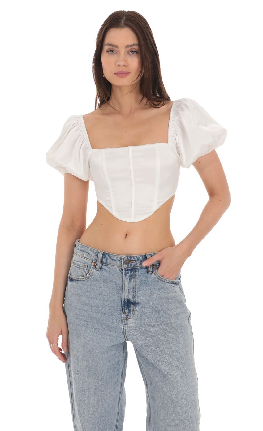 Picture Satin Puff Sleeve Corset Top in White. Source: https://media-img.lucyinthesky.com/data/Apr24/850xAUTO/183e1b52-39b8-49ff-b778-f7cd043f1643.jpg