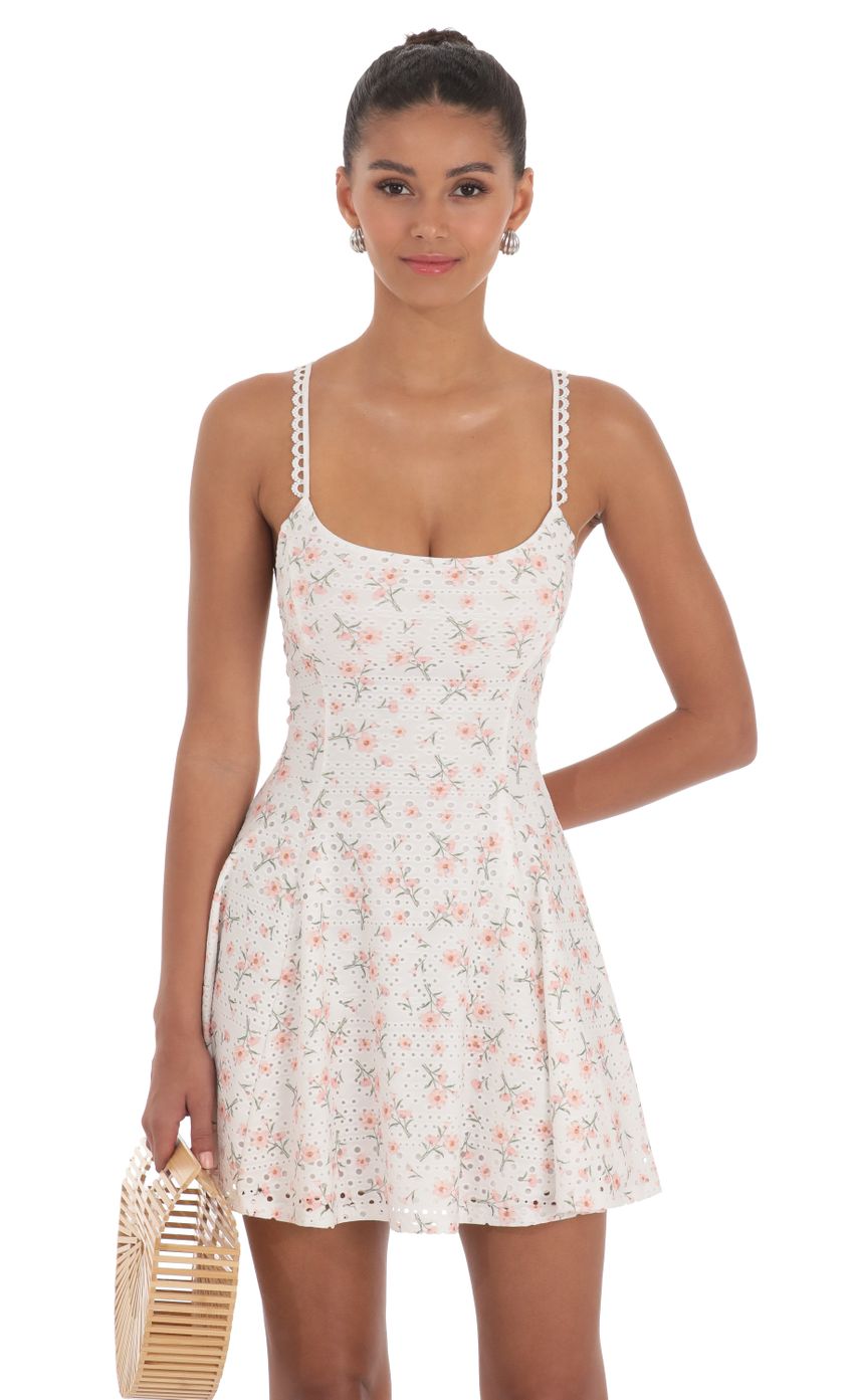 Picture Floral Strap Crossback Fit and Flare Dress in White. Source: https://media-img.lucyinthesky.com/data/Apr24/850xAUTO/1d559f00-13e9-48c9-9485-383c5fc093b9.jpg