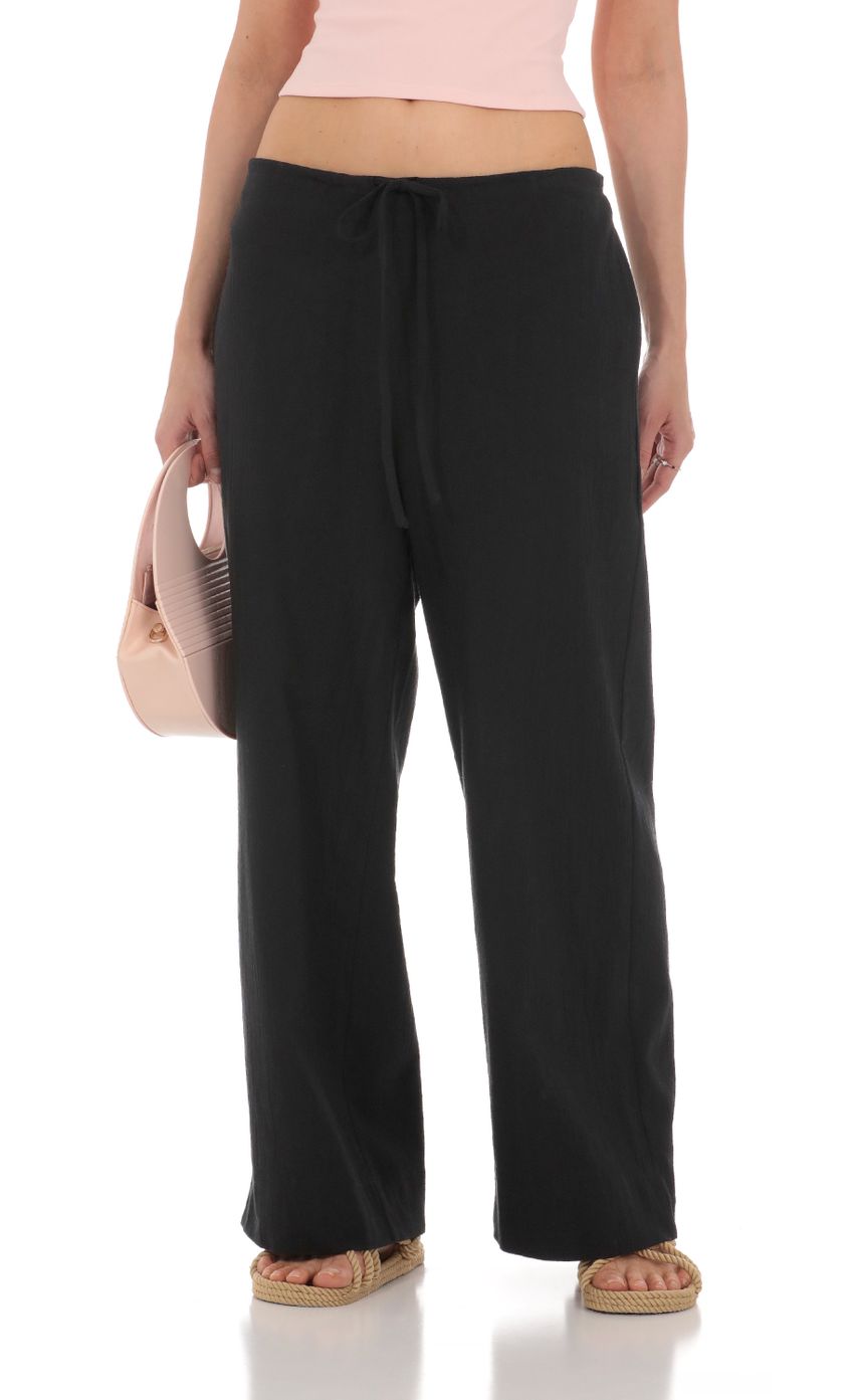 Picture Low Rise Straight Pants in Black. Source: https://media-img.lucyinthesky.com/data/Apr24/850xAUTO/229ce8bb-9402-4973-aea0-62797c122f47.jpg