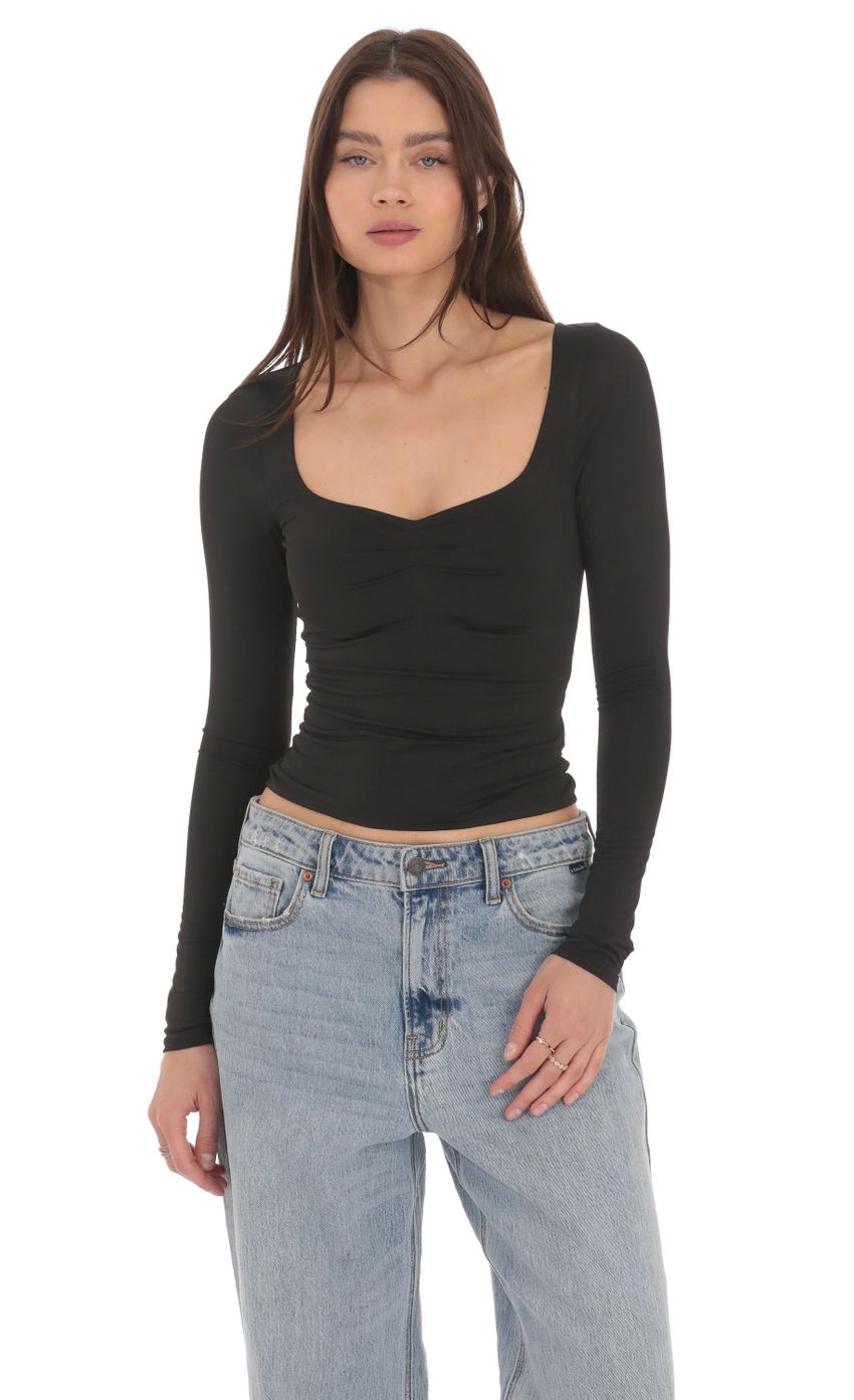 Picture Fitted Long Sleeve Top in Black. Source: https://media-img.lucyinthesky.com/data/Apr24/850xAUTO/2355bd22-0077-4069-a1f9-f8b64ad0caac.jpg