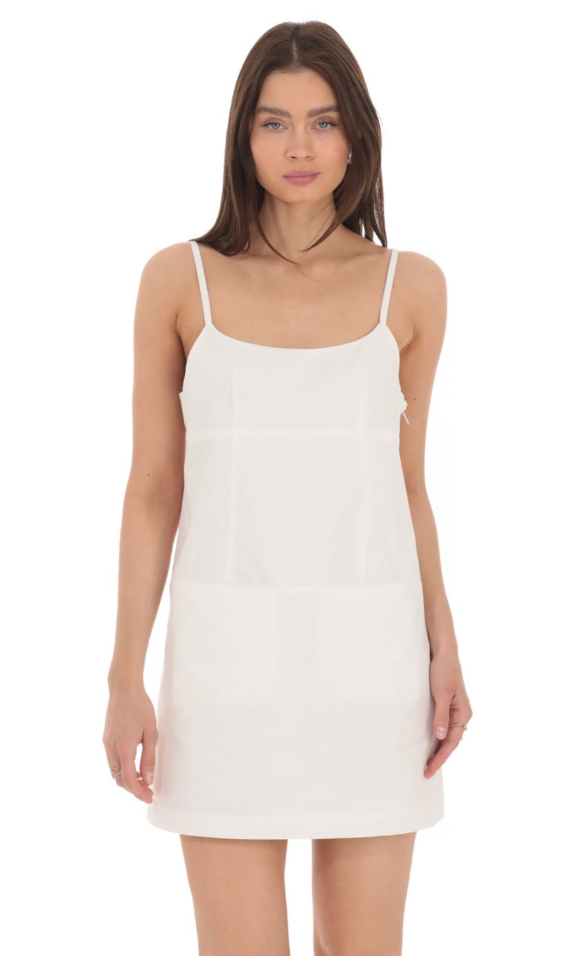 Picture Front Pocket Dress in White. Source: https://media-img.lucyinthesky.com/data/Apr24/850xAUTO/2bb91579-40b6-4376-9b50-fb144259061a.jpg