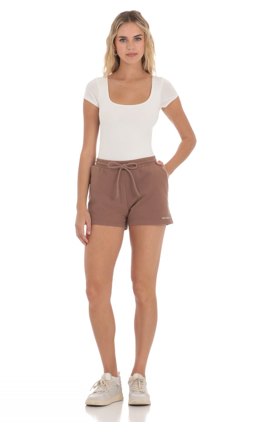Picture Lucy in the Sky Sweat Shorts in Brown. Source: https://media-img.lucyinthesky.com/data/Apr24/850xAUTO/2c946821-1f6e-4b19-9fdb-085552d1f1bc.jpg