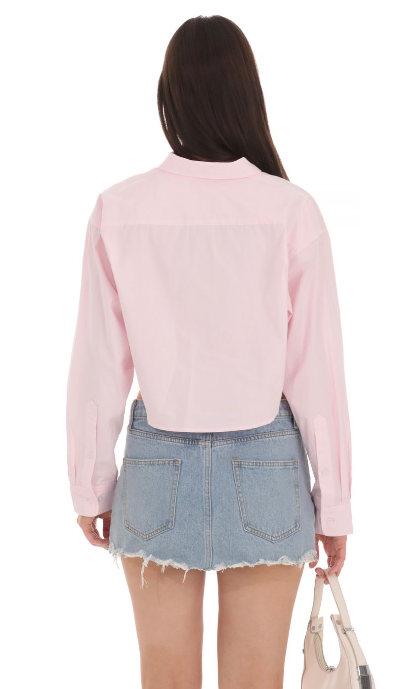 Picture Cropped Button Down Shirt in Pink. Source: https://media-img.lucyinthesky.com/data/Apr24/850xAUTO/32109283-37b0-422a-a26c-a8921e0be784.jpg