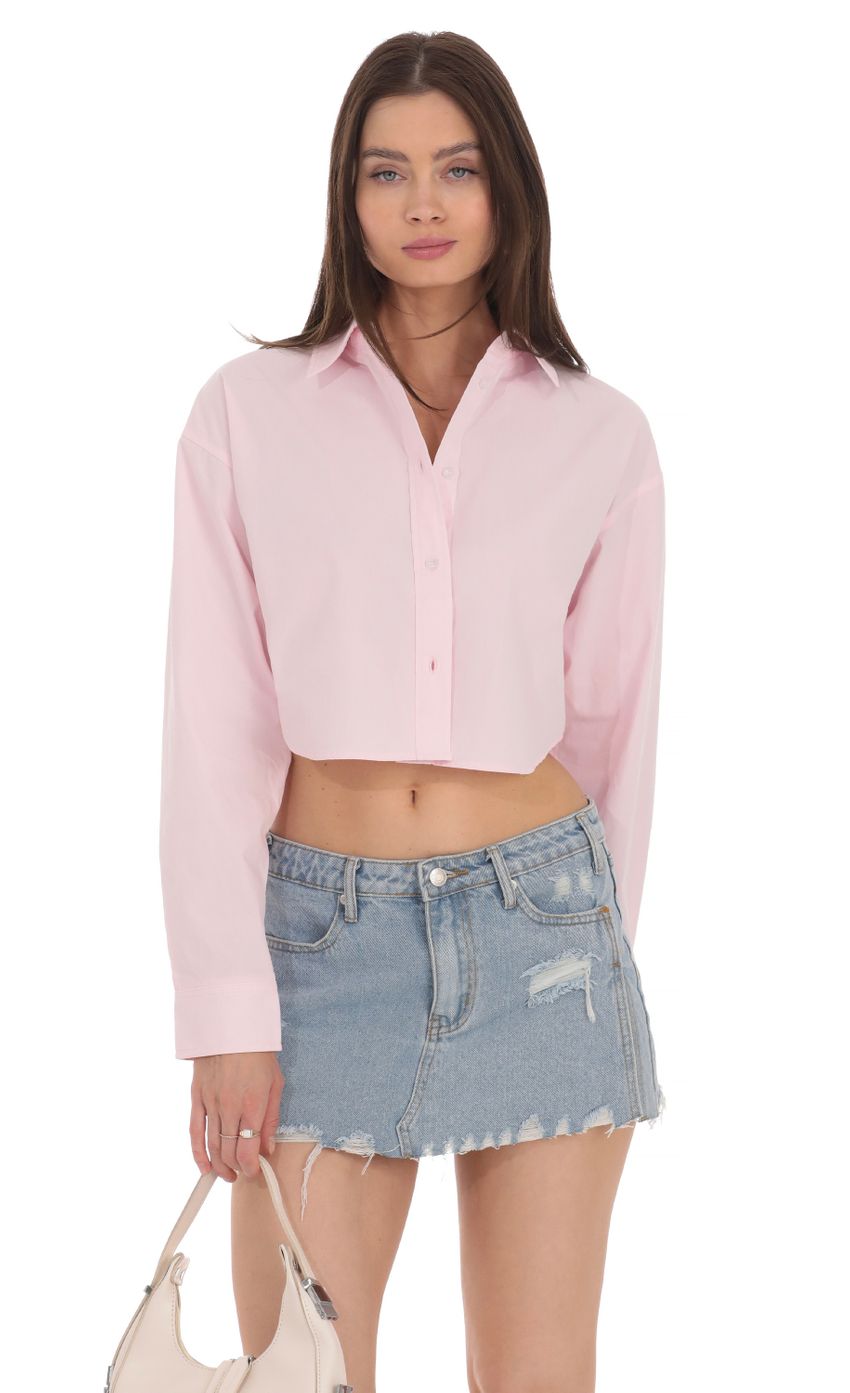 Picture Cropped Button Down Shirt in Pink. Source: https://media-img.lucyinthesky.com/data/Apr24/850xAUTO/39647a3a-17cd-4246-a2f8-01c909ccee07.jpg