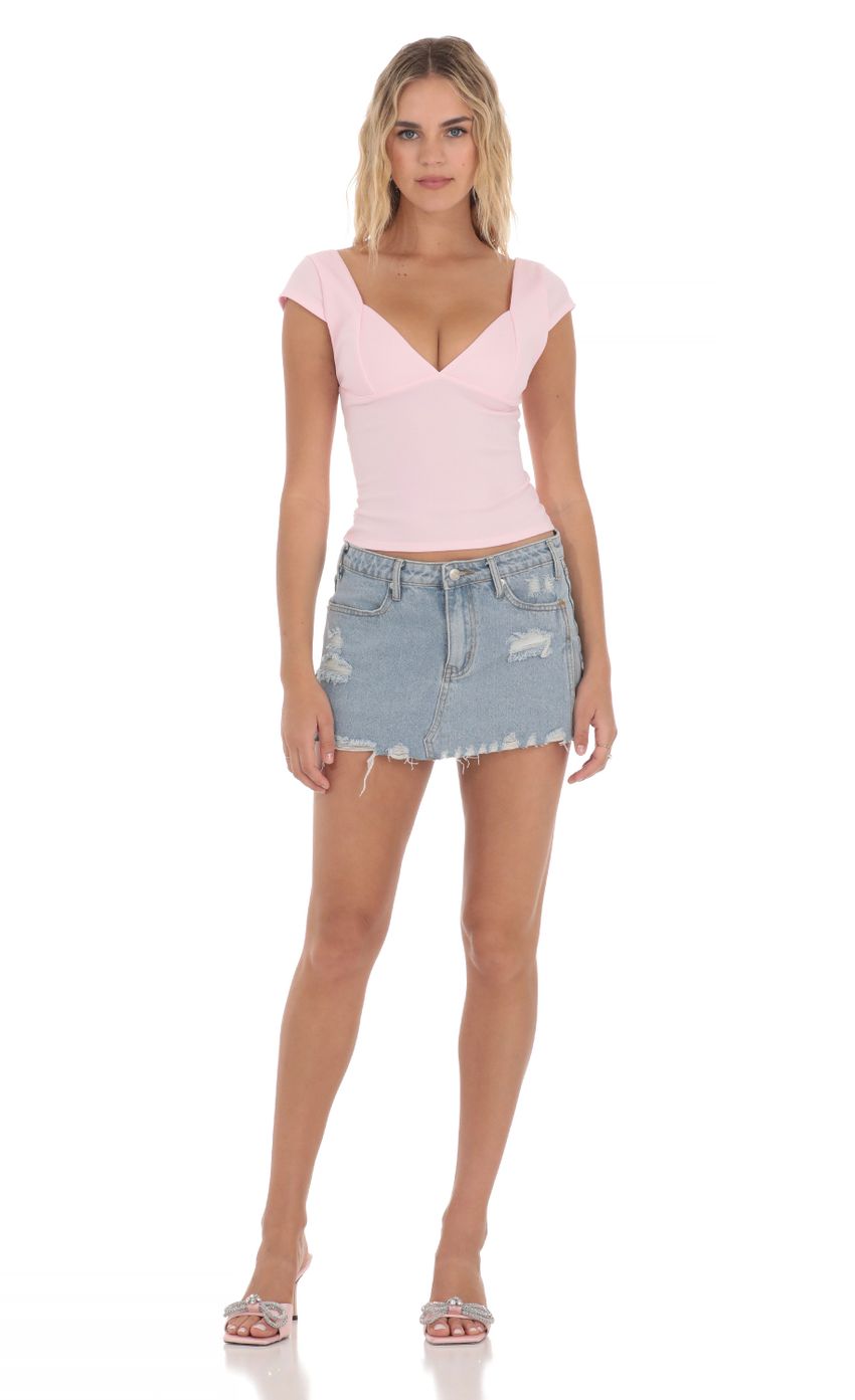 Picture Short Sleeve V-Neck Top in Pink. Source: https://media-img.lucyinthesky.com/data/Apr24/850xAUTO/3fc5a857-604a-4695-a31e-3f1f242ef9e9.jpg
