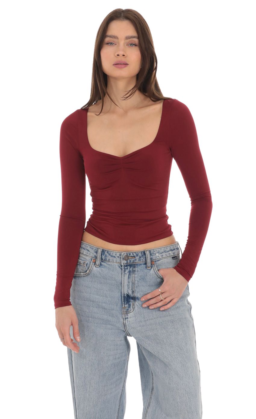 Picture Fitted Long Sleeve Top in Maroon. Source: https://media-img.lucyinthesky.com/data/Apr24/850xAUTO/405fcaab-824d-4557-b4e2-4e22a0986890.jpg
