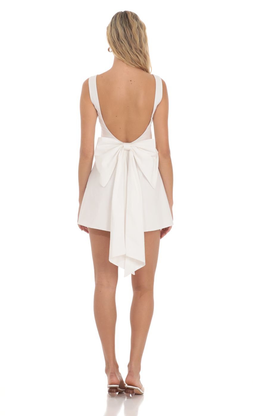 Picture High Neck Back Bow Dress in White. Source: https://media-img.lucyinthesky.com/data/Apr24/850xAUTO/42813661-683a-4919-9415-ef6653a69e96.jpg