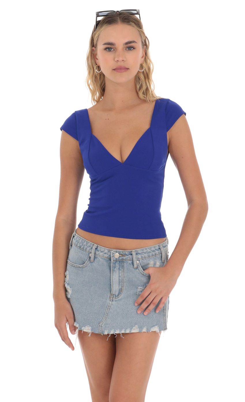 Picture Short Sleeve V-Neck Top in Blue. Source: https://media-img.lucyinthesky.com/data/Apr24/850xAUTO/45115778-9865-467b-9266-dfeea4086654.jpg