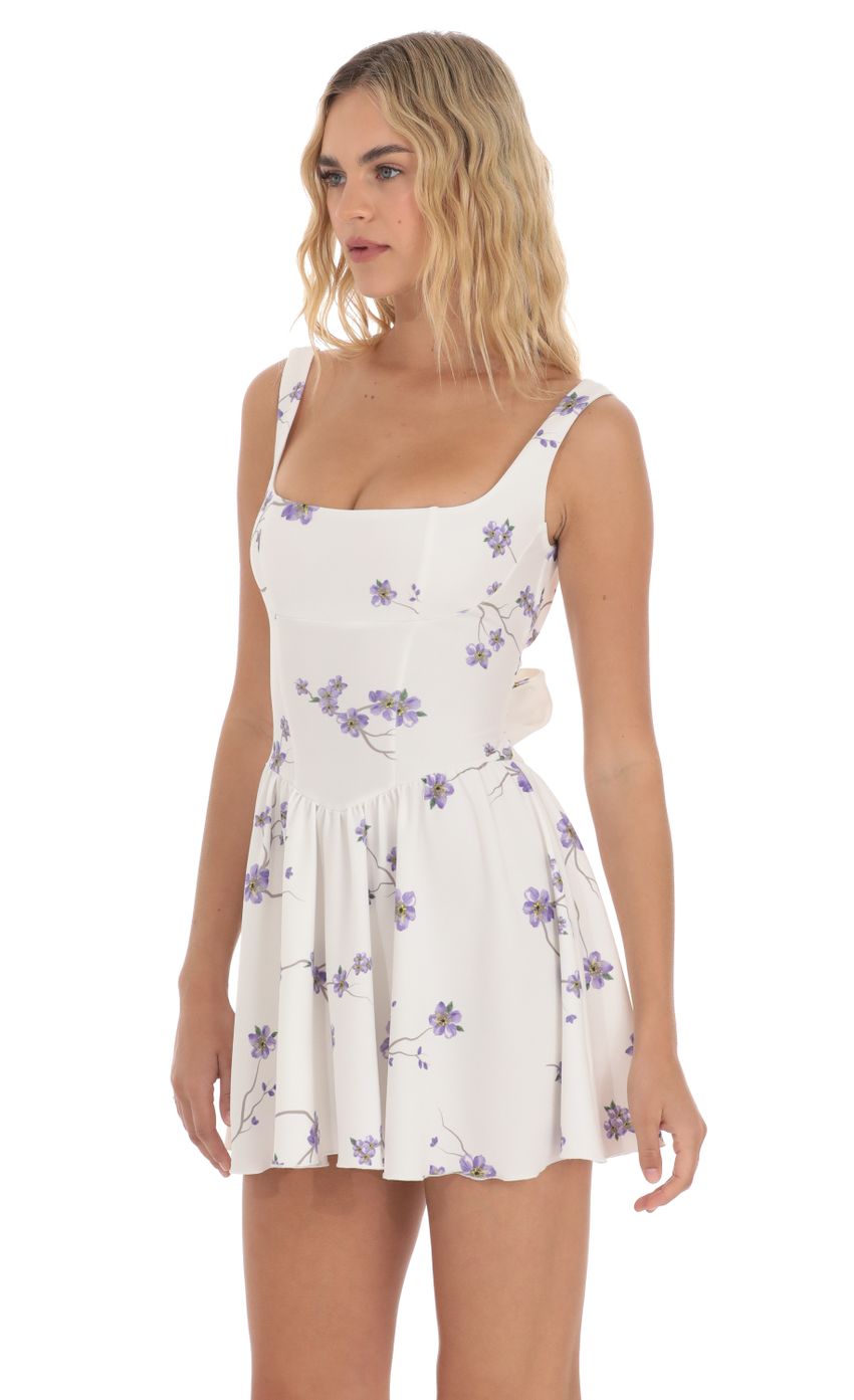 Picture Floral Open Back Flare Dress in White. Source: https://media-img.lucyinthesky.com/data/Apr24/850xAUTO/50c9ae51-a790-4efc-b411-cfa098b8167f.jpg