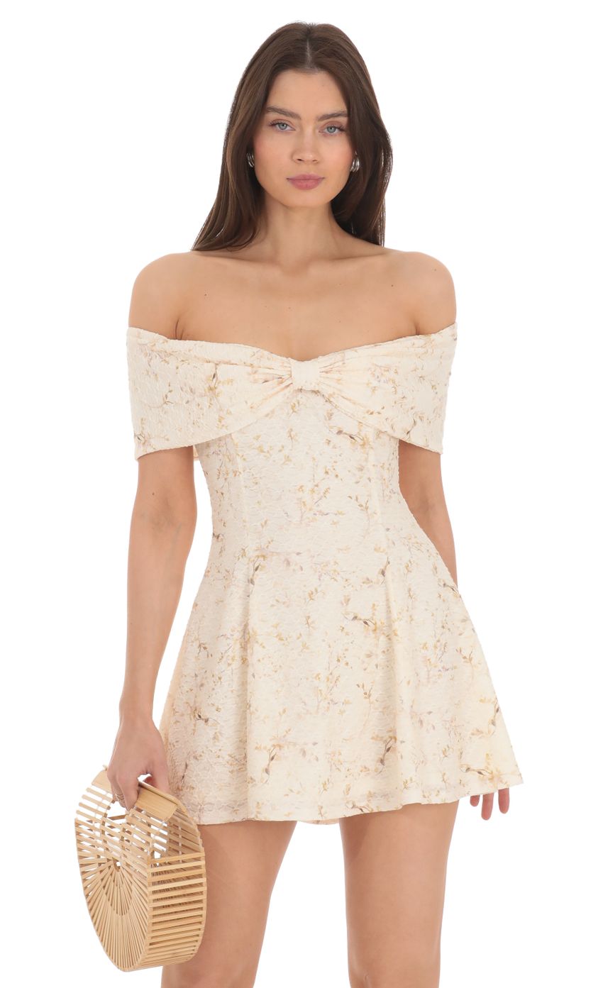 Picture Front Bow Floral Off Shoulder Dress in Cream. Source: https://media-img.lucyinthesky.com/data/Apr24/850xAUTO/53848a31-2fa0-438d-b7f9-c8d5b3c677b0.jpg