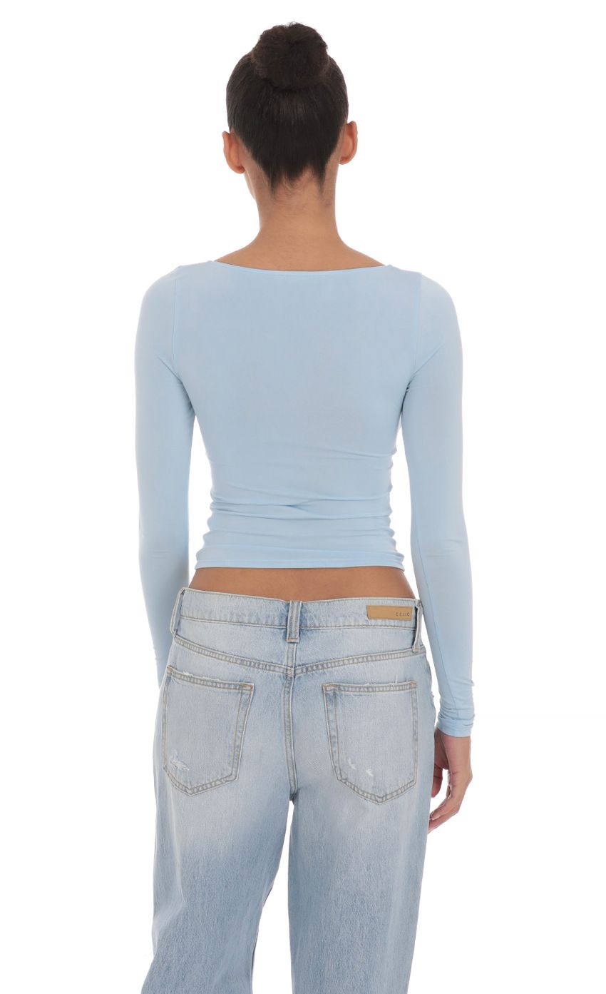 Picture Fitted Long Sleeve Top in Baby Blue. Source: https://media-img.lucyinthesky.com/data/Apr24/850xAUTO/5940dcff-6d67-4aa5-8dcd-76438eb6723c.jpg